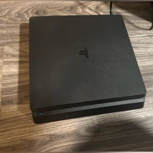 Sony PlayStation 4 slim console with two controllers
